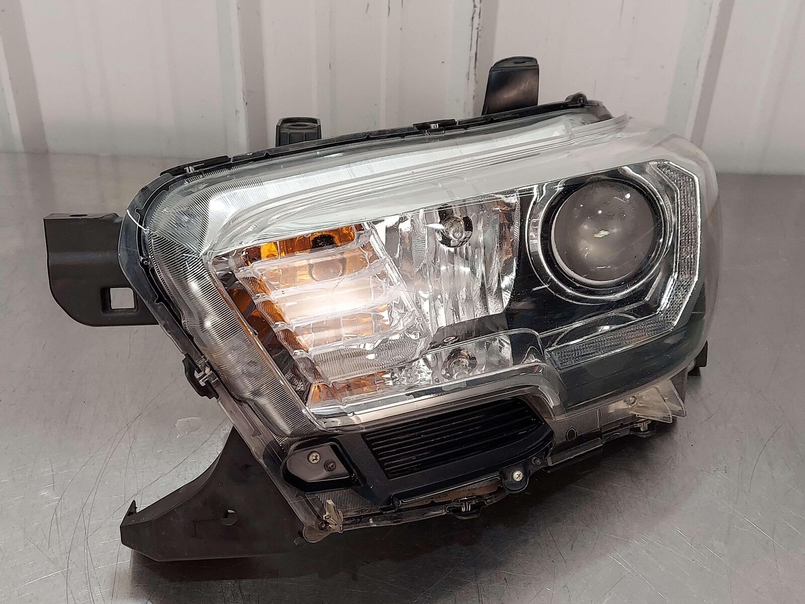 16-23 TOYOTA TACOMA FRONT LEFT HEADLIGHT HEADLAMP HALOGEN W/ CHROME TRIM OEM